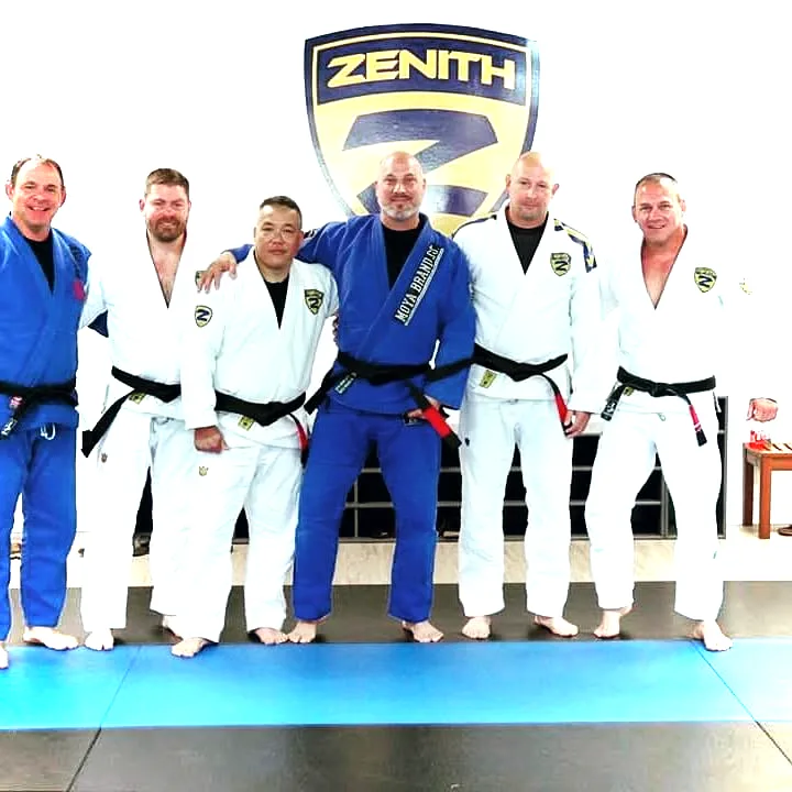 Black belts of Tier 1 Jiu-Jitsu on the mats