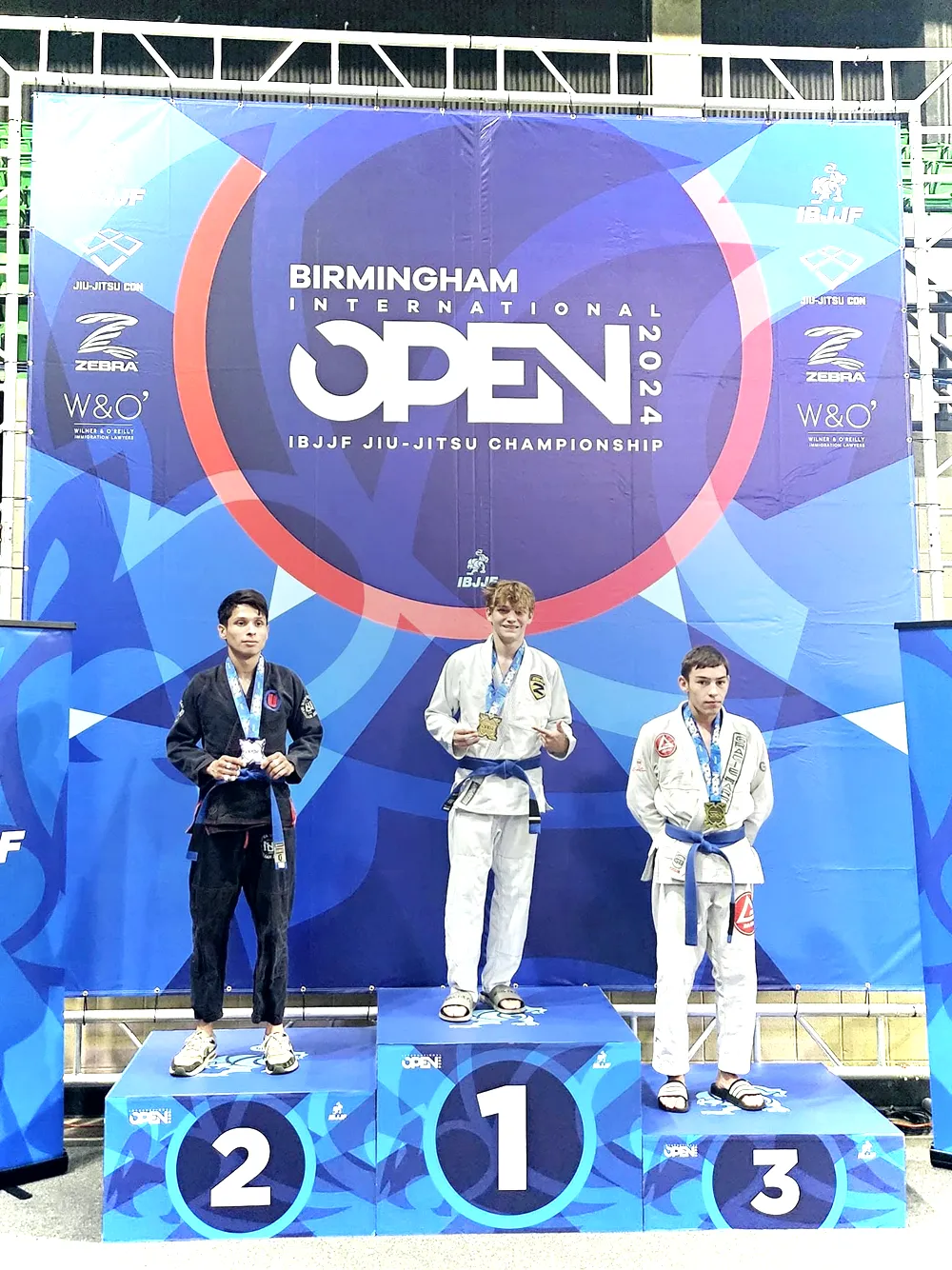 Tier 1 athlete on top of the podium at an IBJJF Open